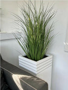 Artificial Grass in Black Pot in white planter