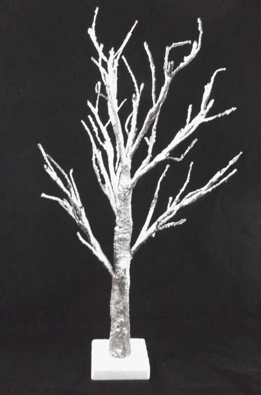 showing Artificial LED Snowy Twig Tree with base against Black background