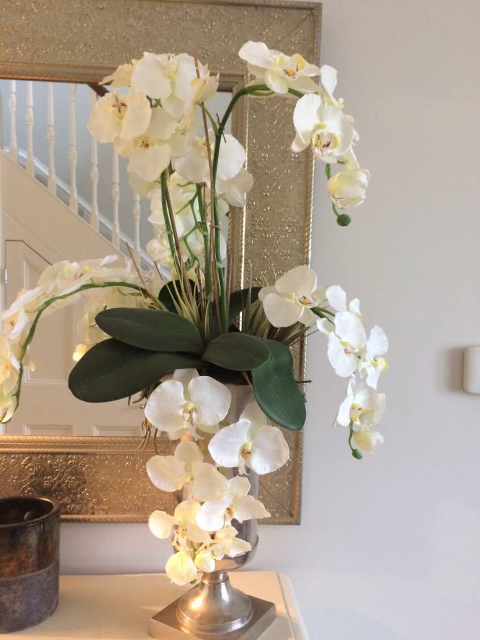 Showing a Bespoke artificial flower arrangement, including the Phalaenopsis leaf, sent in by one of our customers